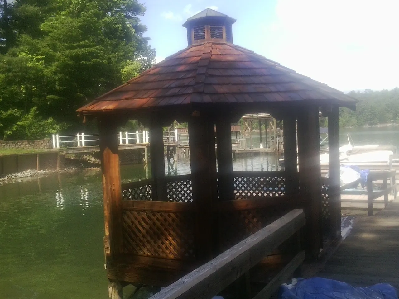 Cedar shake gazebo roof rebuilt on a lake dock in Cutler